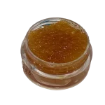 a jar with dab wax with cannabis extracts in it