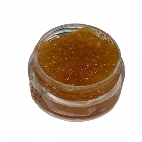 a jar with dab wax with cannabis extracts in it