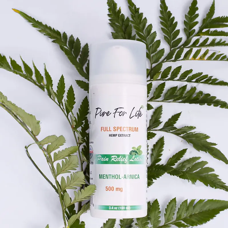 lotion for pain relief made from cannabis with some greens behind it