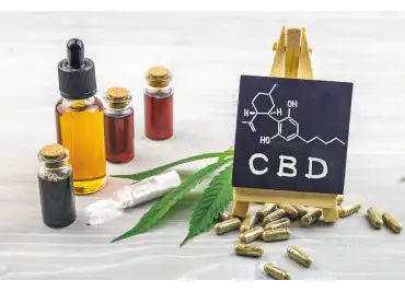 CBD products and a black board on top of a table