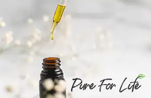 A bottle of CBD oil with a cannabis leaf on the label