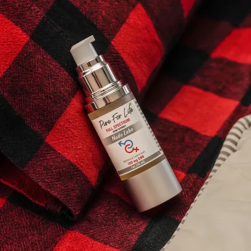 a nude lube pure for life on a red scarf nearly opened